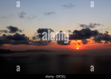 europe greece cyclades sikinos the sun setting over the island of folegandros Stock Photo