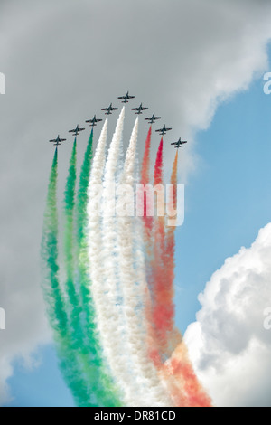 The Italian Aerobatic Display Team Il Frecce Tricolori trailing smoke trails that mimic the Italian flag at the 2013 RIAT Stock Photo
