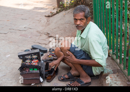 A shoe shine man in Calcutta, India. Stock Photo
