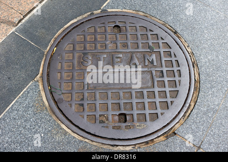 Manhole cover (steam) in the streets of Boston, Massachusetts, USA Stock Photo