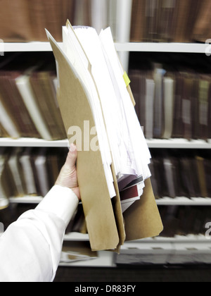 Office Hand Holding a Folder with a Red Color Paper and Pen on the ...