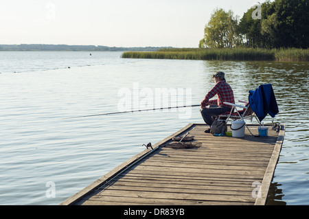 Man fishing on a lake Stock Photo
