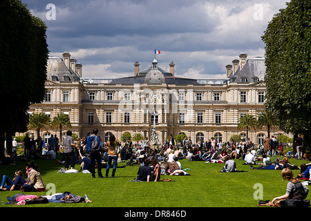 People relaxing in front of Palais Du Luxemboug, Paris, France Stock Photo