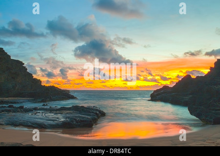 Beautiful sunrise in Halona Cove, also known as Eternity Beach, on Oahu, Hawaii Stock Photo