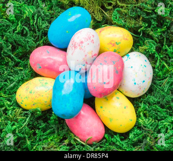 Group of colorful candy robin eggs on green moss Stock Photo