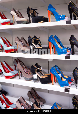 Background with shoes on shelves of shop Stock Photo