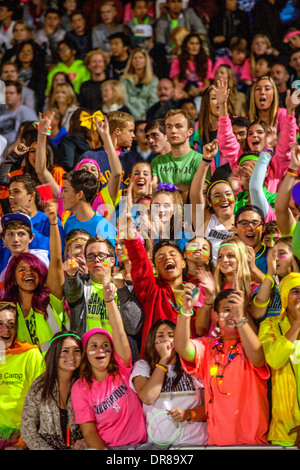 Local fans cheer their home team during a high school night football game in San Juan Capistrano, CA. Stock Photo