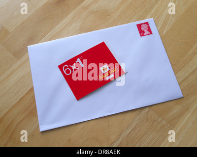 Book of First Class Royal Mail Stamps and Envelope, UK Stock Photo