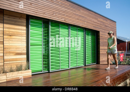 Automatic window shades that react to weather conditions are on the porch of an experimental energy efficient solar powered home designed by a 'Team Capitol DC' student team at the Solar Decathlon in Irvine, CA. The international competition is sponsored Stock Photo