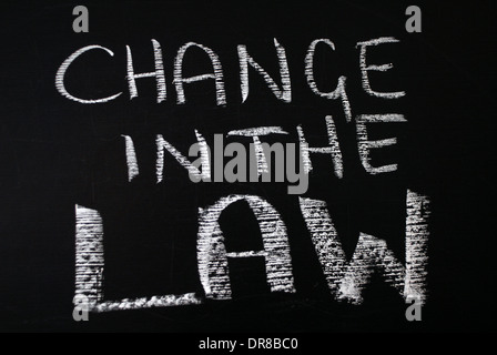 chalk writing -  change in the law. - words written on blackboard. Stock Photo