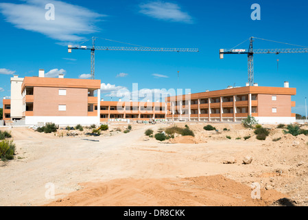Unfinished property development under construction in new town of Gran Alacant close to Alicante, Costa Blanca, Spain Stock Photo
