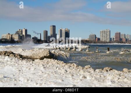 Chicago, USA. 21st January 2014.  Lake Michigan waves crash into ice formations at snowy North Avenue Beach after the latest lake effect snowstorm. The polar vortex has returned with frigid temperatures. Credit:  Todd Bannor/Alamy Live News