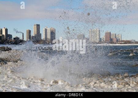 Chicago, USA. 21st January 2014.  Lake Michigan waves toss chunks of ice into the air at snowy North Avenue Beach after the latest lake effect snowstorm. The polar vortex has returned with frigid temperatures. Credit:  Todd Bannor/Alamy Live News