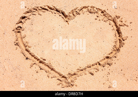 Heart drawn in sand on the beach Stock Photo