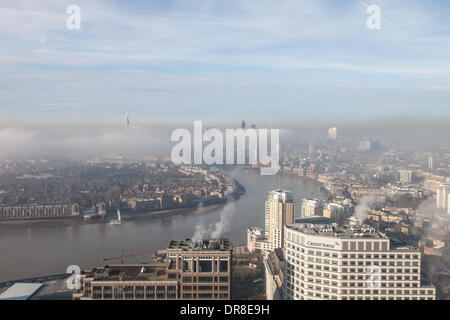 London UK, 21st Jan 2014. A bank of low fog shrouds the City of London and surrounding areas. The tops of London's tallest buildings are visible above the fog. This shot was taken from Canary Wharf. © Steve Bright/Alamy Live News Credit:  Steve Bright/Alamy Live News Stock Photo