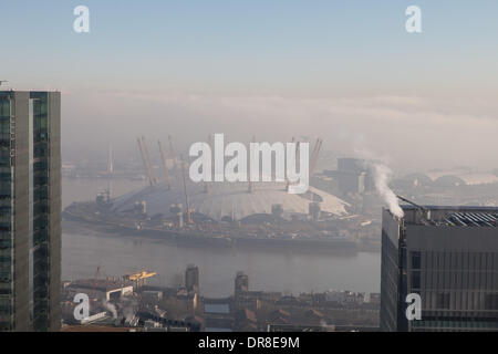 London UK, 21st Jan 2014. The early morning fog disperses revealing the O2 Arena on the Greenwich Peninsula. Dense fog to the east is still visible. This was shot from 1 Canada Square in Canary Wharf. © Steve Bright/Alamy Live News Credit:  Steve Bright/Alamy Live News Stock Photo