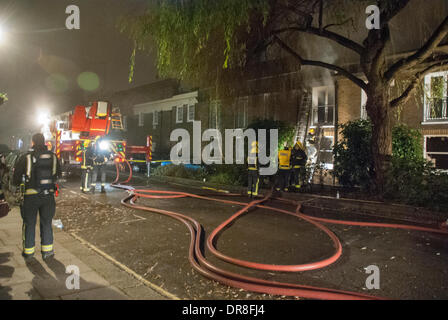 London, UK . 21st Jan, 2014. London Fire Service crew tackle a house fire at Hyde Park Gardens Mews, Paddington, central London. Credit:  Peter Manning/Alamy Live News Stock Photo