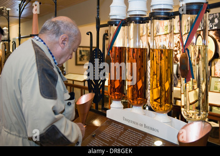 Man Examining a Bourbon Display at the Woodford Reserve Visitor Center and Distillery in Woodford County, Kentucky Stock Photo