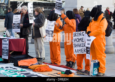 Protestors in Orange Suits  marking the twelfth anniversary of the opening of the extralegal prison camp at Guantánamo Bay Stock Photo