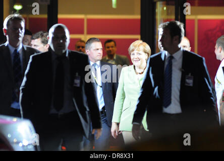 German Chancellor Angela Merkel leaves the match, surrounded by heavy security  The 2012 European Championships Quarter Final between Germany and Greece, at the PGE Arena, Gdansk. Germany won the match 4-2. Gdansk, Poland - 22.06.12 Stock Photo