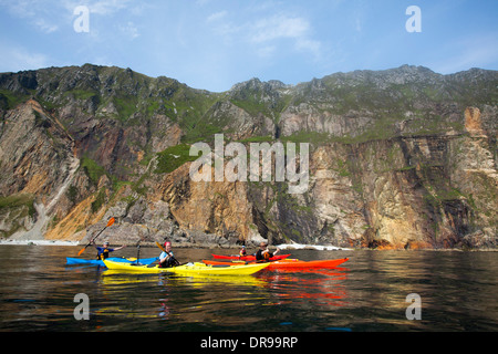 Sea kayaking beneath the Slieve League cliffs, County Donegal, Ireland. Stock Photo