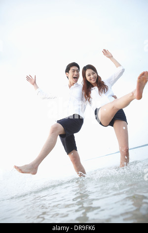 a man and a woman at a beach Stock Photo