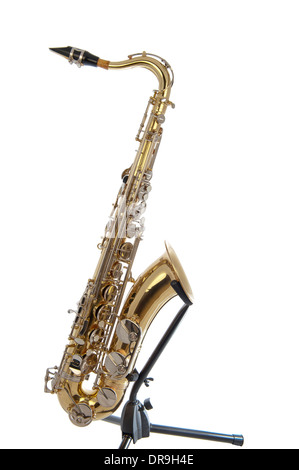 Brass tenor saxophone with silver valves and pearl buttons on a stand isolated in white Stock Photo