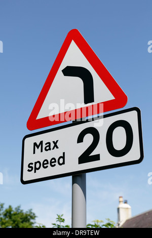 Maximum Speed Limit 20 MPH and Bend to the Left Ahead road