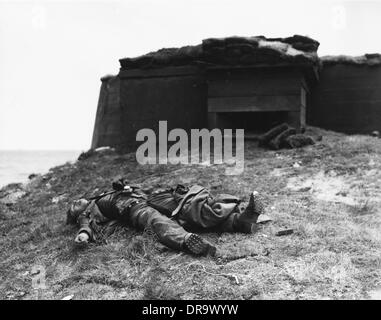 D-Day - Dead German soldier by pillbox Stock Photo