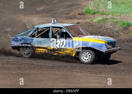 Race for survival. Blue yellow car on the track Stock Photo