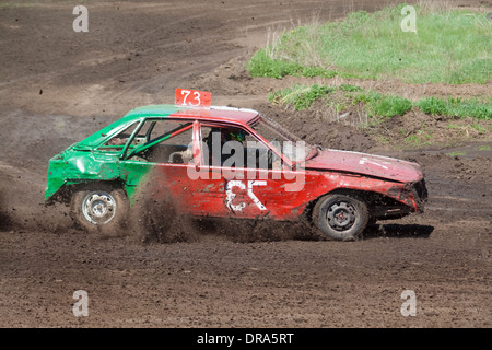 Race for survival. Green red car on the track Stock Photo