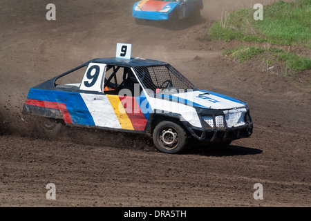 Race for survival. Blue white car on the track Stock Photo