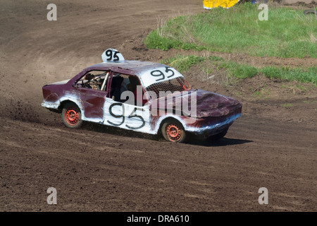 Race for survival. White purple car on the track Stock Photo