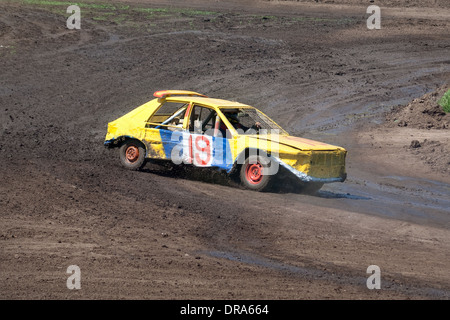 Race for survival. Yellow car on the track Stock Photo