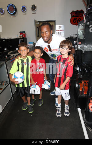 Didier Drogba Professional football players from the English Premier League host an event at Eaglerider Motorcycles in support of 'armsaroundthechild.org' Los Angeles, California - 01.07.12 Stock Photo