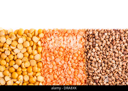Shredded peas, lentils and buckwheat on white background Stock Photo