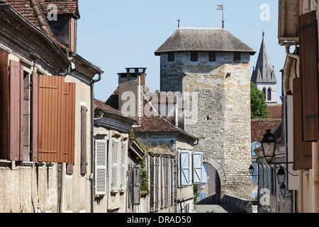 View down Rue du Pont-Vieux to the 14th century fortified bridge at Orthez, Aquitaine, France Stock Photo
