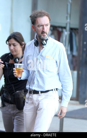 Director John Carney filming on the set of his new movie 'Can A Song Save Your Life?' in Manhattan. The movie centers around a dejected music business executive who ends up forming a friendship with a young singer-songwriter who is new to Manhattan. New York City, USA - 03.07.12 Stock Photo