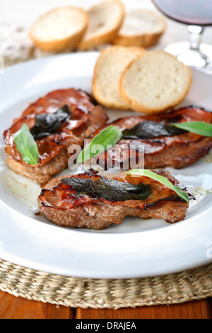 Saltimbocca alla romana - Roast meat with wine Stock Photo