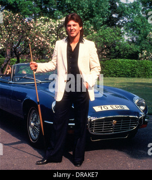 Canadian Kirk Stevens at The Embassy World Snooker Tournament, Crucible Theatre Sheffield in the early 1980’s poses with an E-ty Stock Photo