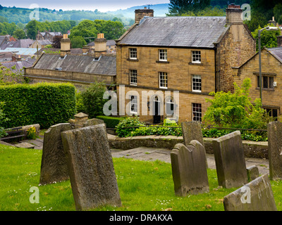 The Graveyard of All Saints Church Bakewell Derbyshire Dales Peak District  England UK with houses visible in the background Stock Photo