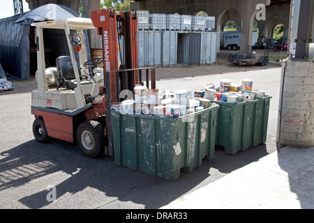 Tubs of paint cans to be recycled at the Household Hazardous Waste Collection Site. St Paul Minnesota MN USA Stock Photo