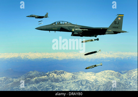 U.S. Air Force F-15E Strike Eagle aircraft drop 2,000-pound joint direct attack munitions on a cave in eastern Afghanistan Stock Photo
