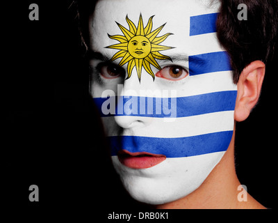 Flag of Uruguay Painted on a Face of a Young Man Stock Photo