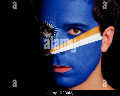Flag of Marshall Islands Painted on a Face of a Young Man Stock Photo