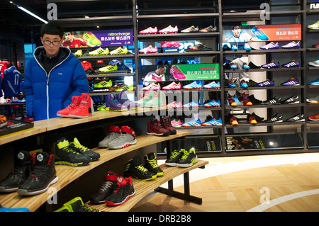 people shop at adidas outlet in beijing china 21 jan 2014 stock photo alamy
