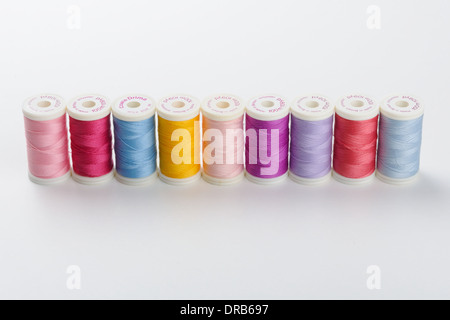 Coloured threads by Drima on neutral background Stock Photo