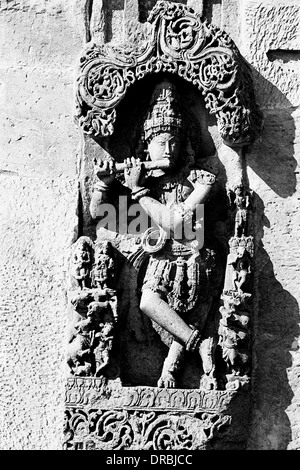 Lord Krishna playing flute sculpture, Belur, Karnataka, India, 1985 Stock Photo