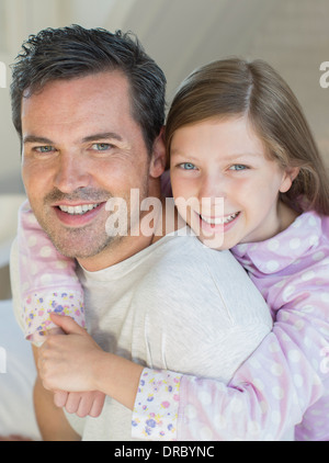 Father carrying daughter piggyback Stock Photo