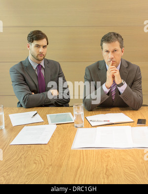 Businessmen sitting in meeting Stock Photo